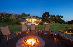 outdoor firepit with lawn chairs