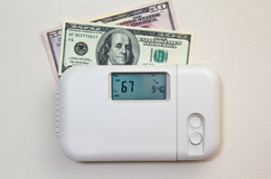 home thermostat with $150 next to it