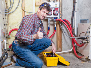 technician performing a heating repair