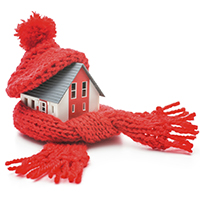 mini house with a red hat and scarf wrapped around it