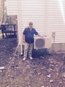 man standing with a central ac unit